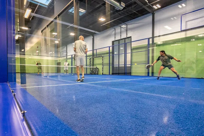 Adults playing padel